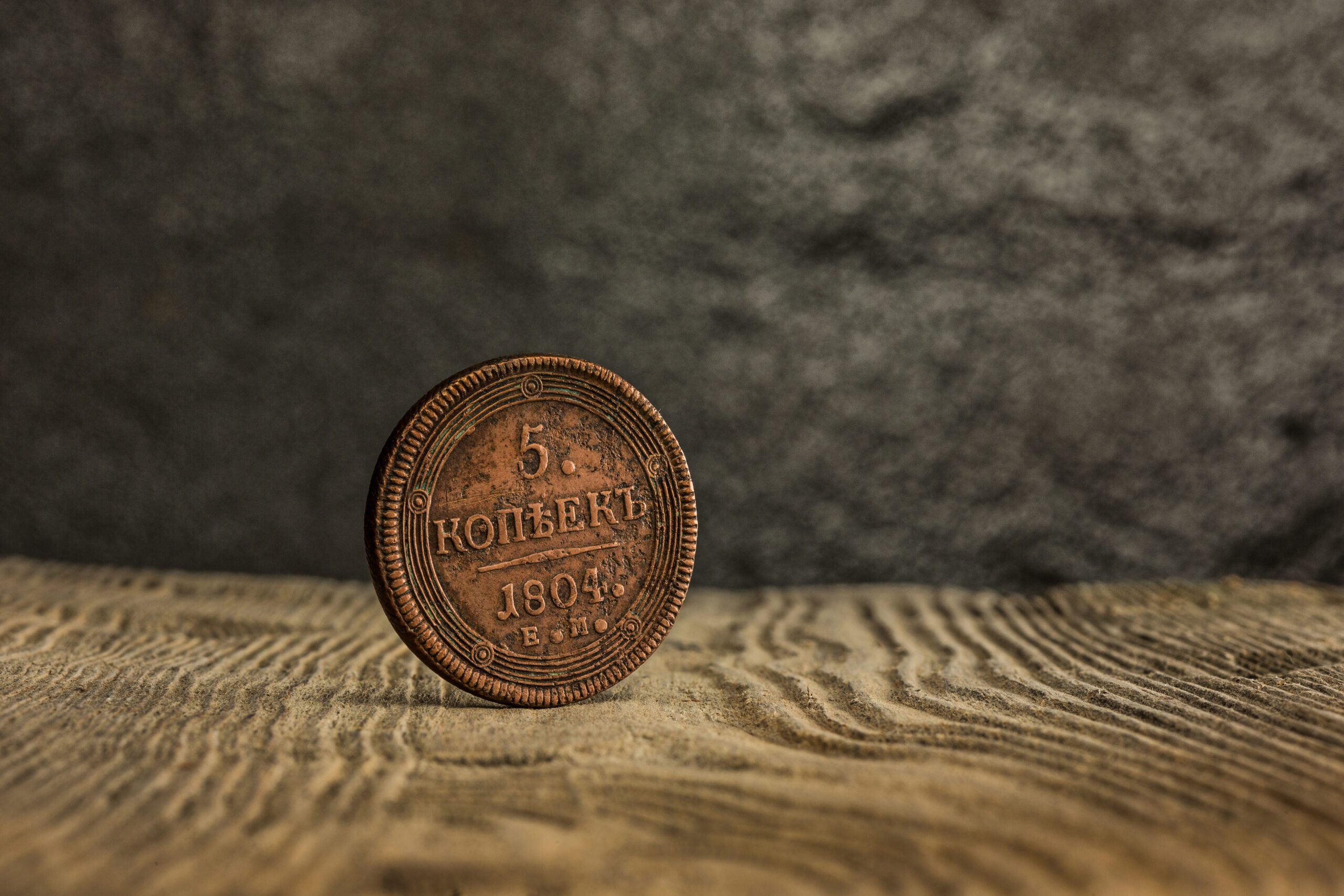 Coin from 1804 on wooden table