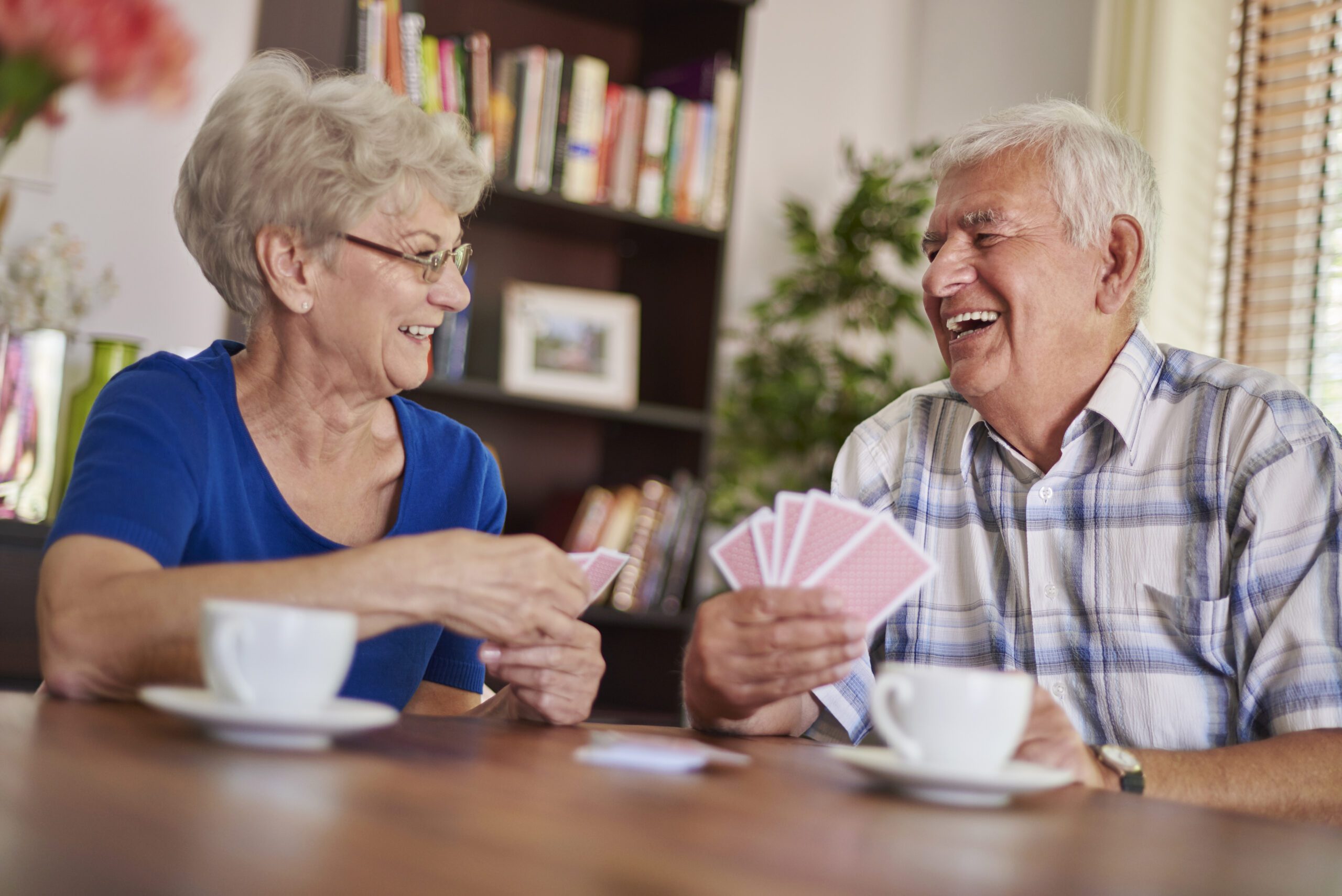 seniors playing cards and love spending time together
